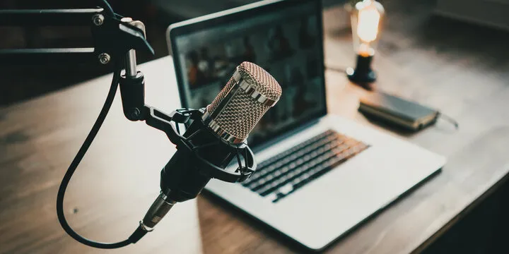 Microphone and laptop podcast image
